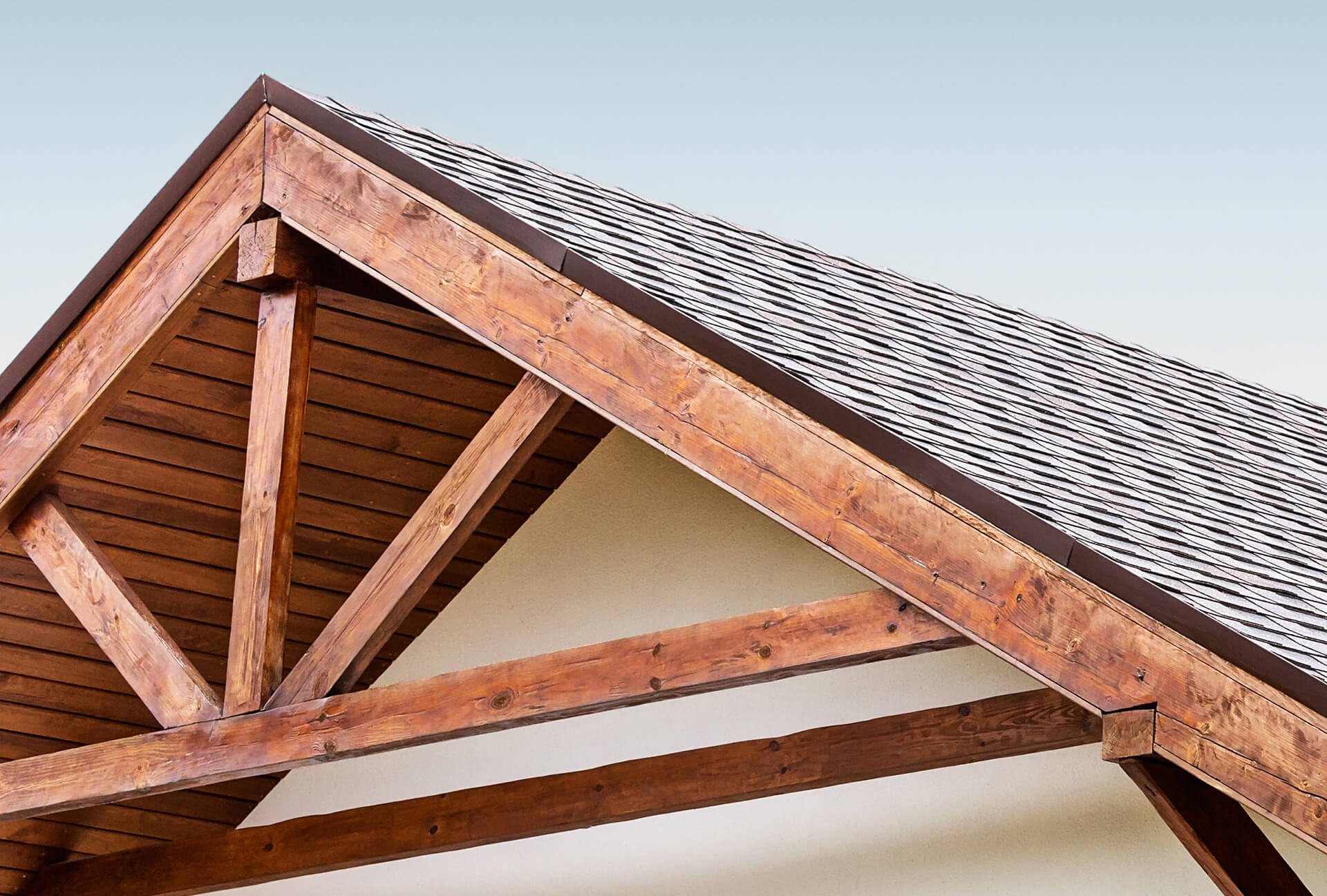 a wooden house with a roof